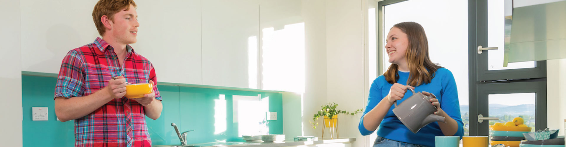 Male and female international student in kitchen of UCD student accommodation