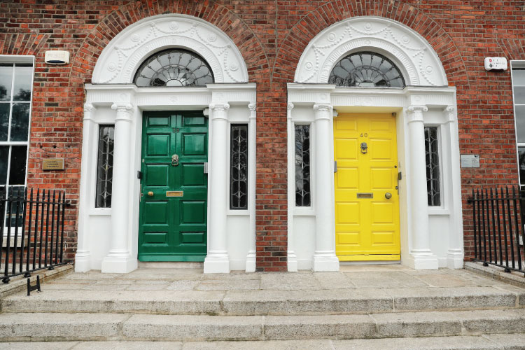 Green and yellow Georgian doors in Dublin City