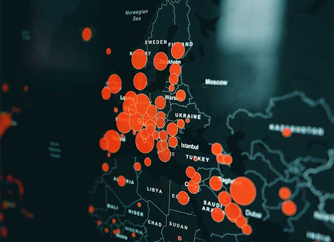 Dark map of Europe and nearby regions with bright red/orange circles of varying sizes marking data points, clustered over Central and Eastern Europe; country labels like Sweden, Poland, Ukraine, and Turkey are visible.