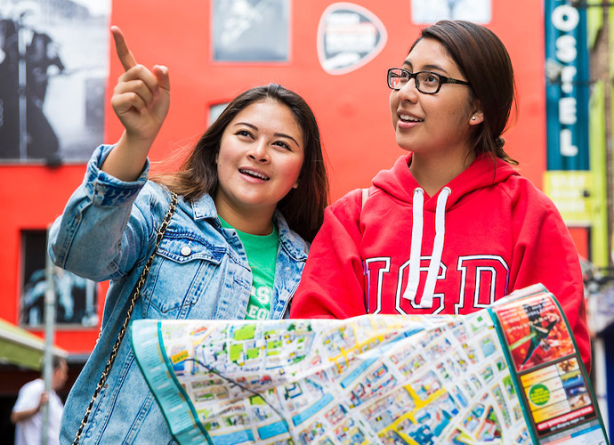 Two students hold a map in Temple Bar, Dublin.