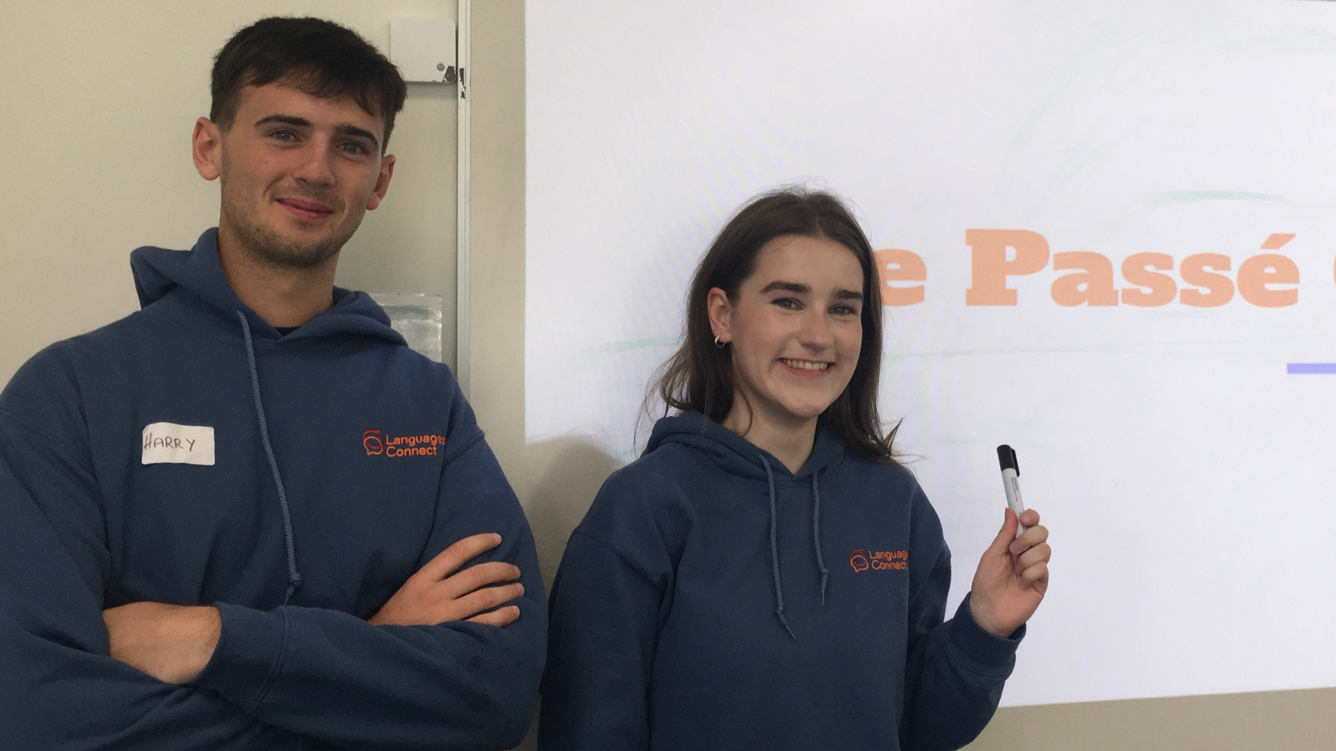 Two students in front of whiteboard