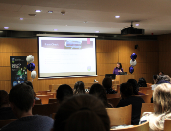 People sitting in lecturer theatre watching talk on International Women's Day 2024
