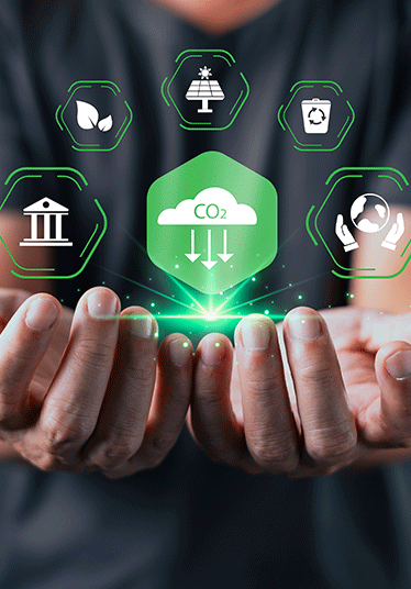 A person holds out their hands beneath glowing eco icons and a green CO2 cloud symbol, representing environmental sustainability, carbon reduction, and clean energy initiatives