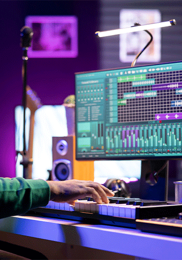 Musician playing piano keyboard and recording tracks for mix and master session, using digital software on pc to create new songs. Sound producer composing music with midi controller tool.