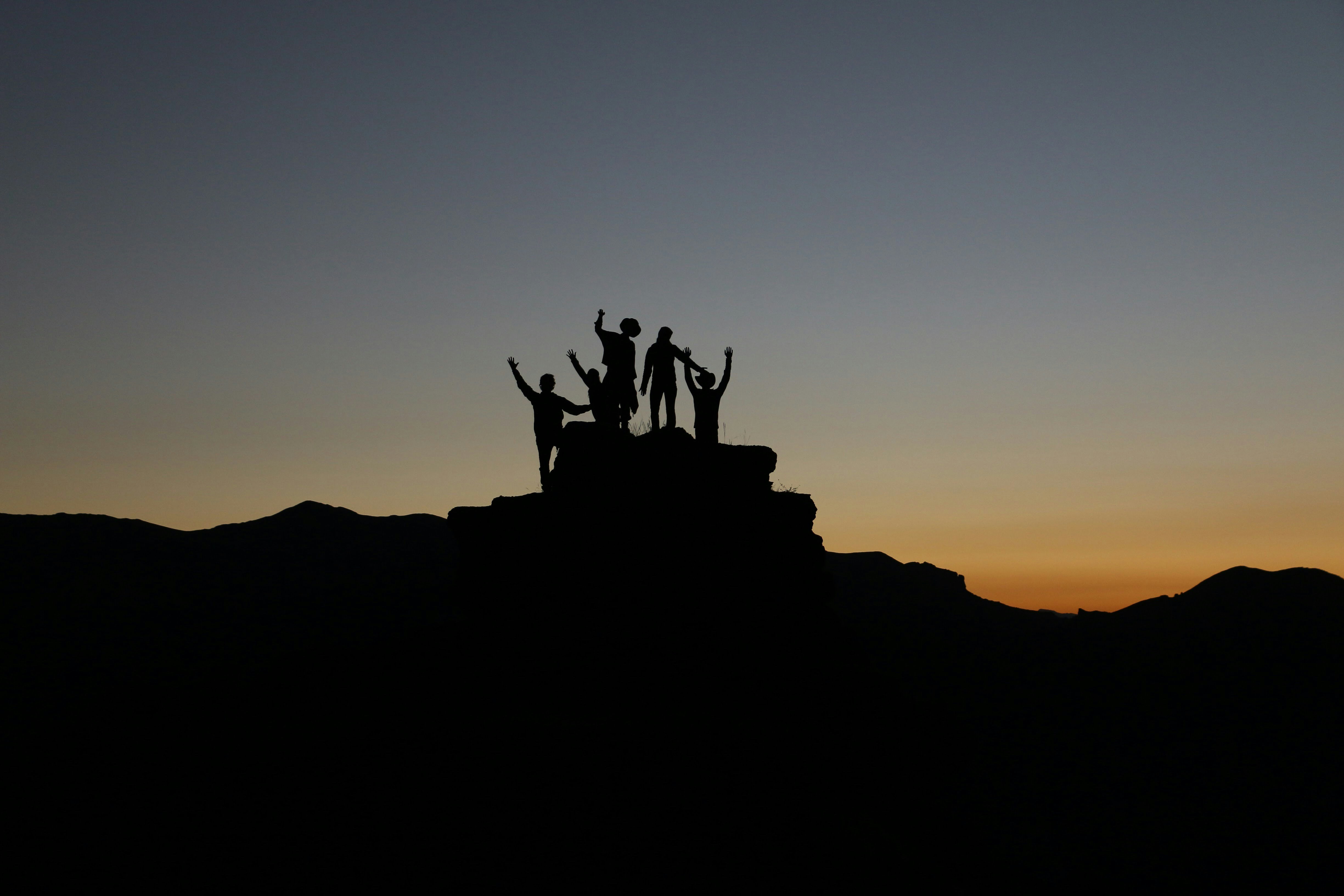 people at the top of a mountain