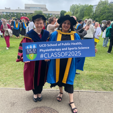 PhD student with academic at UCD graduation