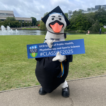 JJ UCD mascot holding Class of 2025 sign at UCD graduation