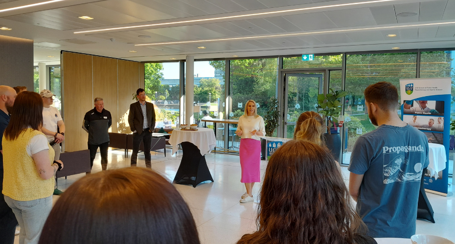 Evanne NiChuilinn addressing a crowd at UCD University Club