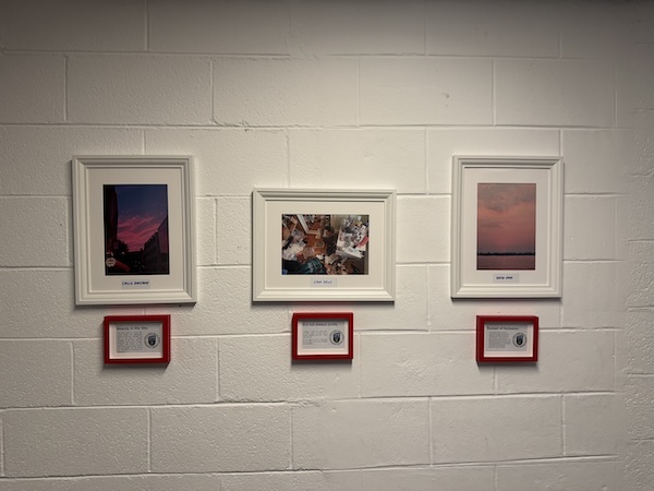 3 photos are framed on a wall with a caption under each