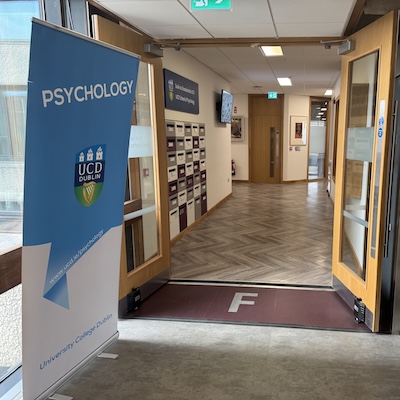 A banner to the left of an open doorway reads School of Psychology