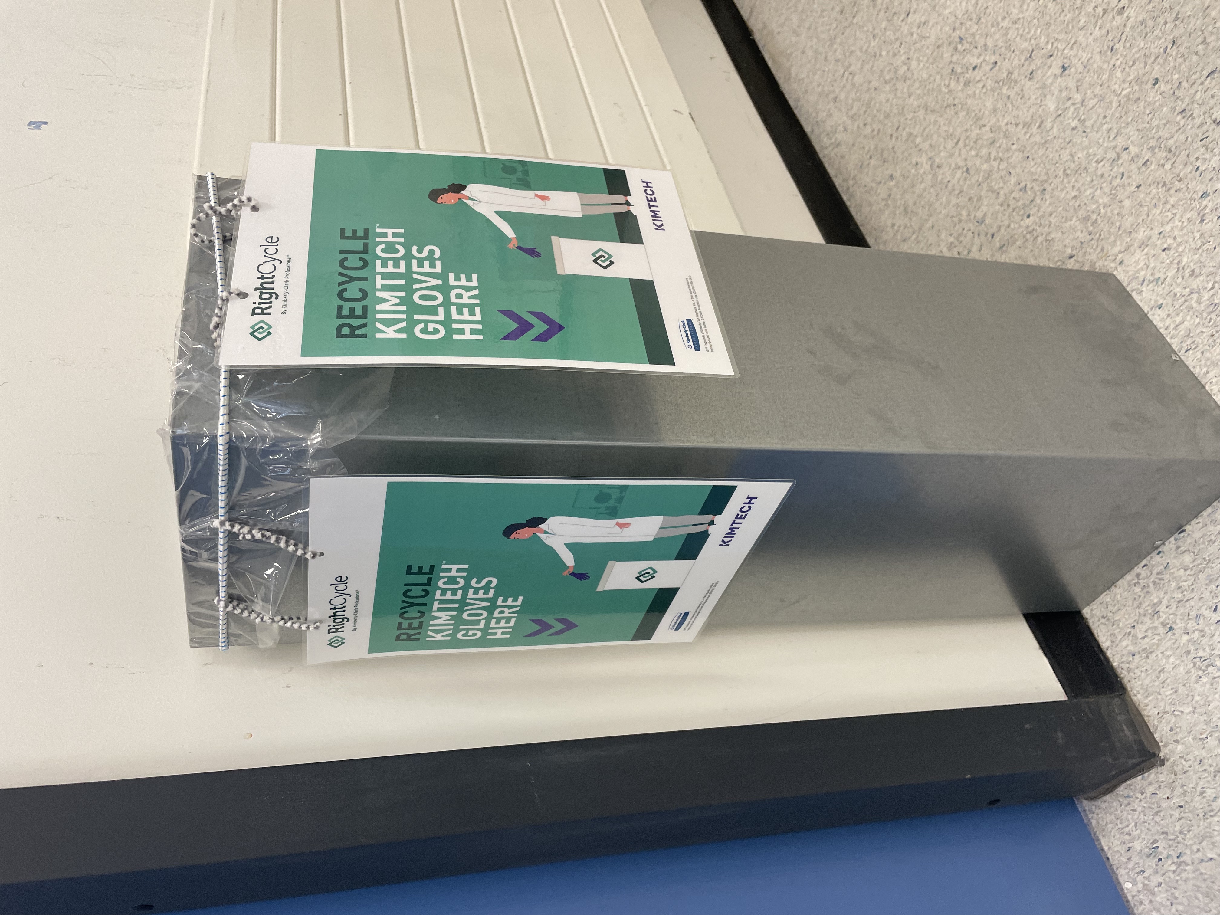 Grey rectangular collection bin in teaching lab