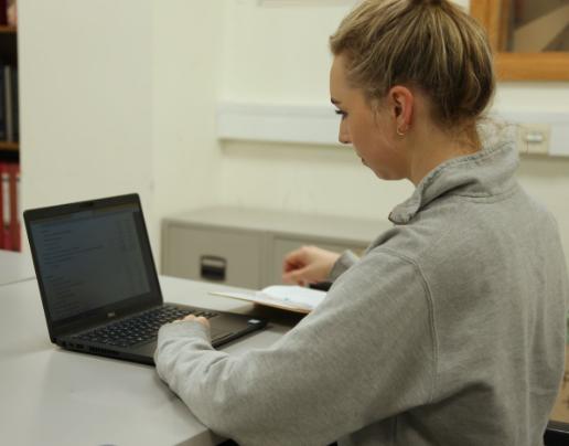 Student looking at a laptop