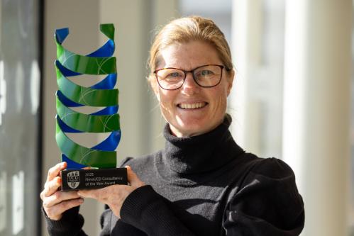 Dr Siobhan Mullen smiling and holding her UCD Nova Award